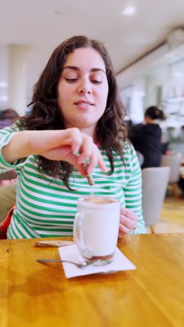 young woman enjoying a coffee break at the cafe
