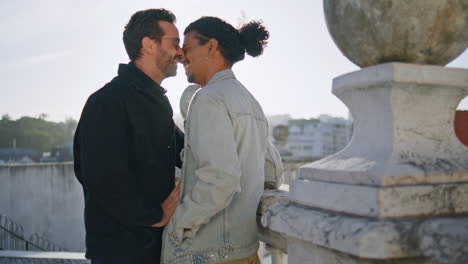 affectionate couple on a rooftop