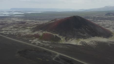 aerial view of red crater and unpaved road in snaefellsnes, western iceland