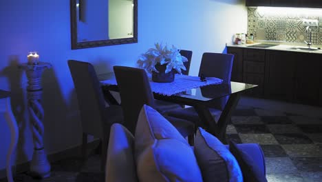 close up shot illuminated bedroom whith seen through wall towards the dining area
