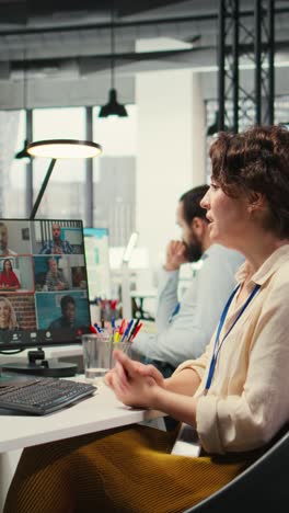 vertical video employees sharing ideas on a web video conference call at the workstation