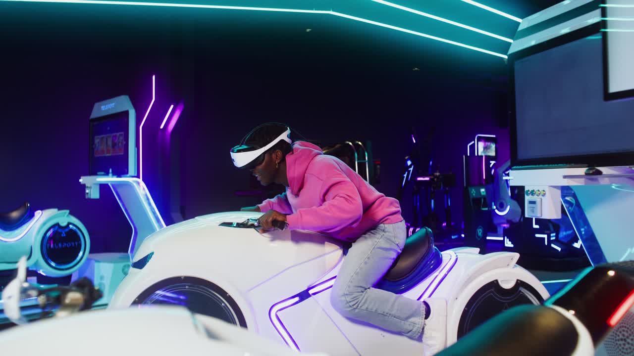 A person riding a VR motorcycle game in an arcade