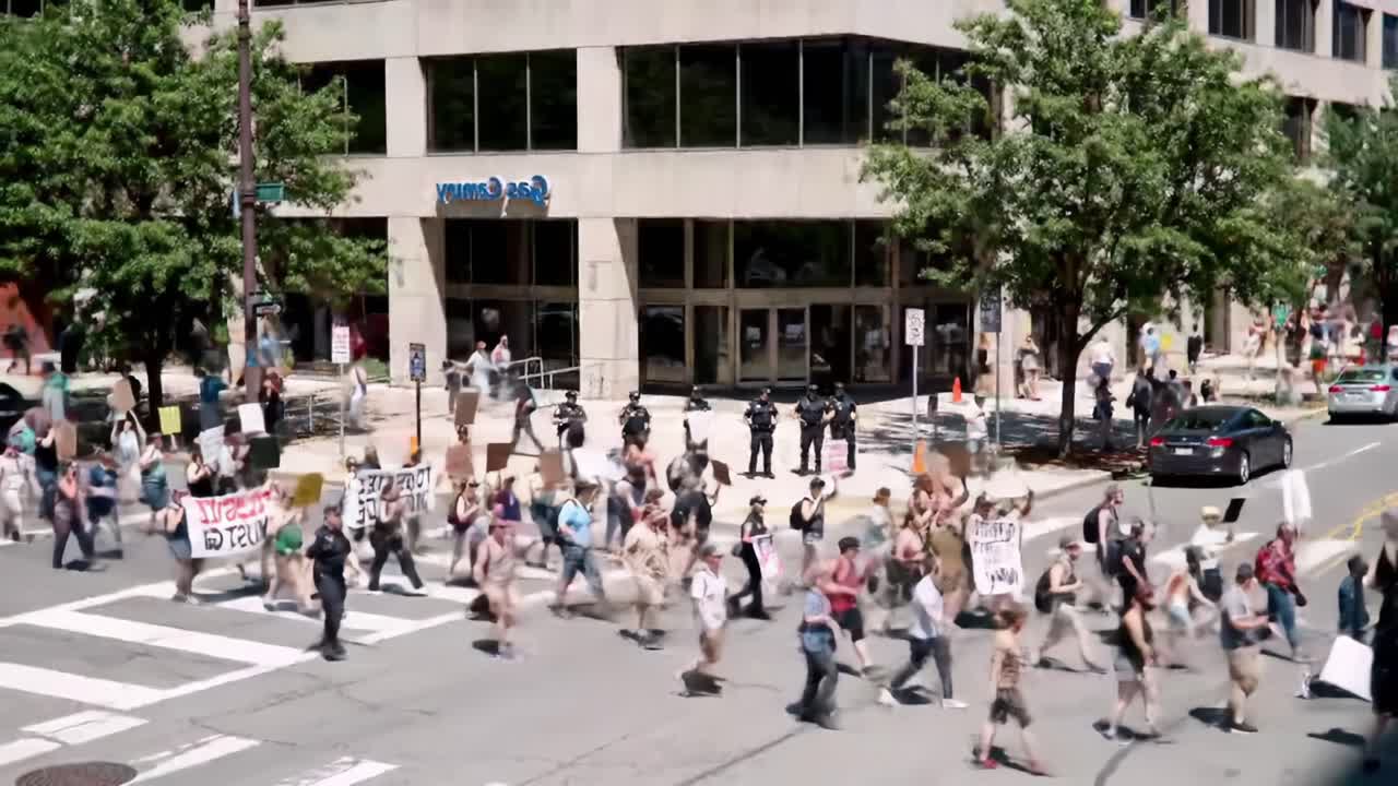 March for Justice in the City Center With Activists and Law Enforcement Present