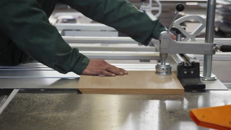 workshop workers use industrial wood saw machine