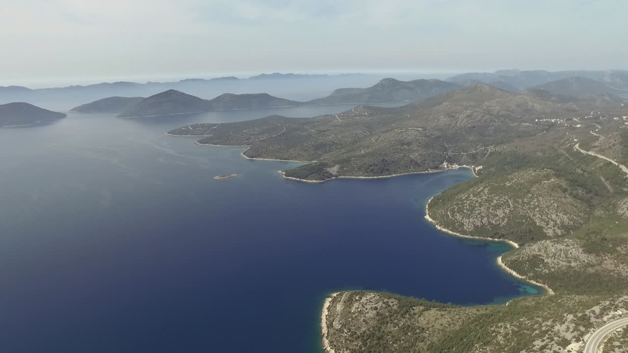 Flight over desert islands and colorful sea, Brijuni park, Croatia