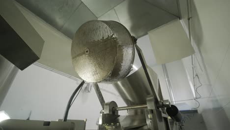 production of potato chips and snacks. chips are fried in a large bowl with butter