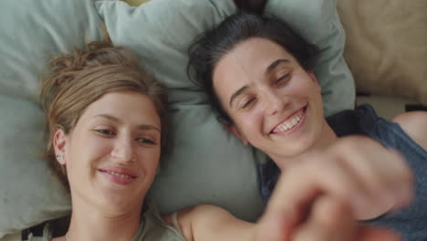 romantic lesbian couple bonding on bed