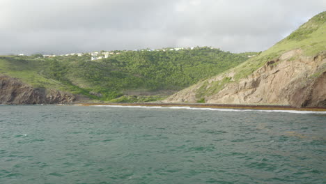 abandoned caribbean beach in the early morning. smooth fly in, low to the beach below covered in seaweed. a small town can be seen on mountains in the distance. part 1 of 2.
4k uhd at 23.98 fps.