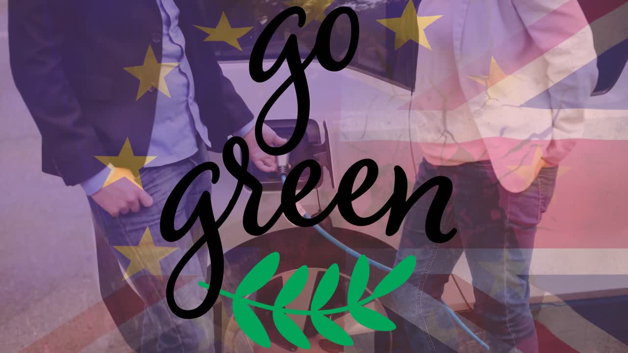 영국 국기 위에 초록색 텍스트와 전기 자동차를 충전하는 남자