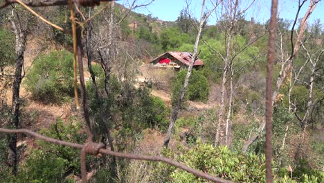 A-rundown-and-scary-cabin-in-the-hills-is-seen-from-a-distance