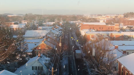 aerial over rooftops of downtown lititz, pennsylvania usa during snowstorm