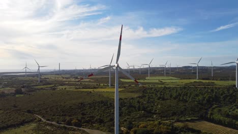 green energy concept, windmill landscape, blades rotating, blue sky, aerial