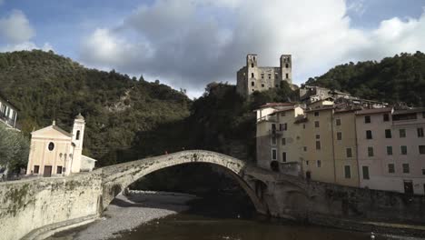 ancient bridge and village in the italian mountains