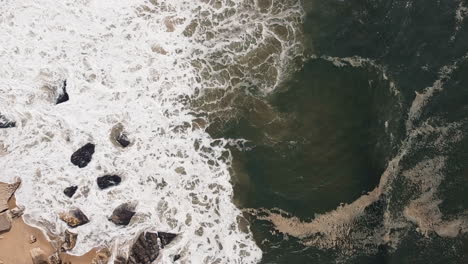 foamy waves at nazaré, portugal from above. aerial