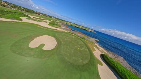 fpv of los corales golf course and its scenic surroundings in punta cana, dominican republic - drone shot