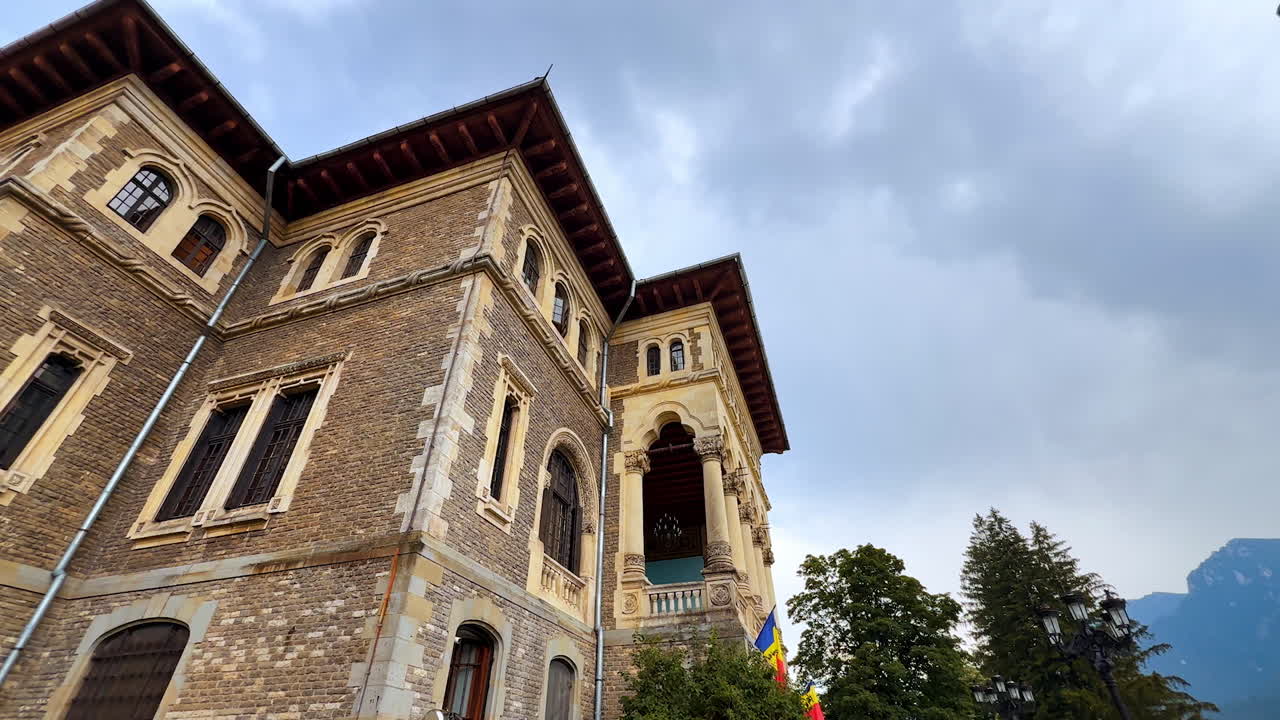 Busteni, Romania, 17 July 2025: Watching a stunning historical Cantacuzino Castle in Busteni, Romania. Low angle view at the building and its territory