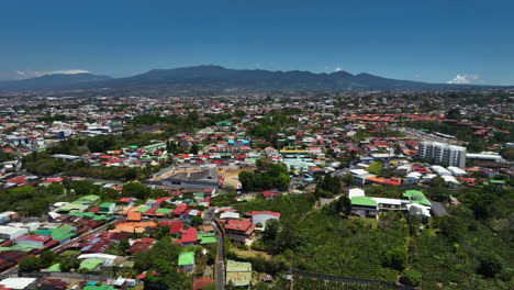 aerial view over a residential community in san jose, sunny day in costa rica