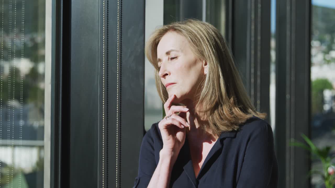 Woman looking through the window