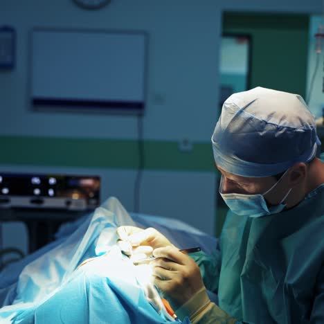 plastic surgery in clinic. professional doctor doing a blepharoplasty to a patient's face with medical tools. cosmetic procedure.