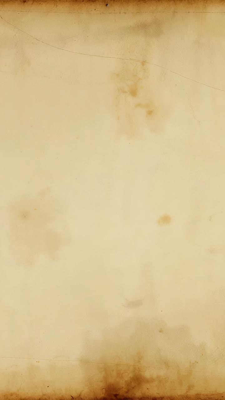 Vertical video: Landing ink droplet spreading on aged paper forming dark circular blot, copy space
