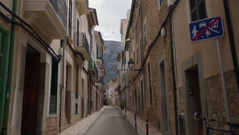 quiet street in soller, mallorca with traditional architecture