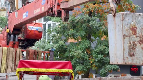 crane lifting materials at a construction site