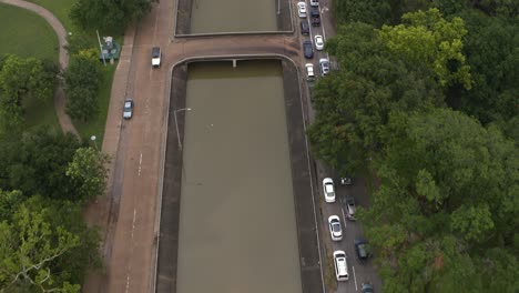 Drone-view-of-under-bridge-flooding-on-Allen-Parkway-in-Houston,-Texas