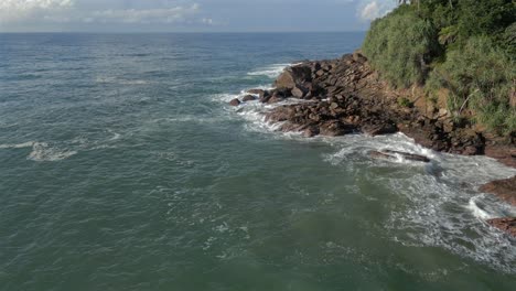 60 fps aerial drone shot of rocky tropical coastline in southern sri lanka
