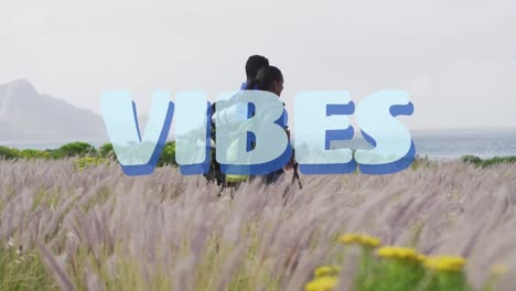 animación de la palabra vibra escrita en azul sobre una pareja de senderismo en el campo