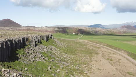 gerouberg basalt columns during sunny day in iceland landscape, aerial