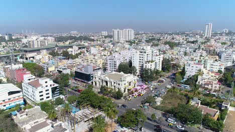 aerial circle pan of chikmagalur downtown on a sunny day