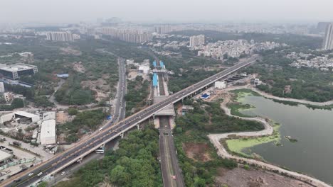 wide angle drone shot revealing construction projects, bridge and metro development
