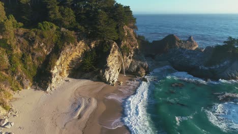 4k uhd drone - dji aerial footage of the enchanting mcway falls and beach in julia pfeiffer burns state park, at highway one, big sur, california | usa westcoast road trip