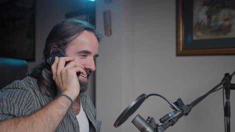 man recording a podcast or video call from home