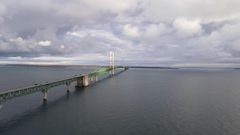 sun shines on the historic mackinac bridge over the straights of mackinac, in michigan usa - aka "mighty mac