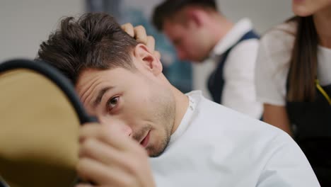 Handheld-view-of-handsome-man-in-hair-salon