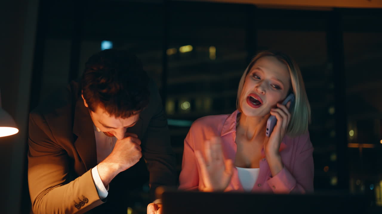 Excited Business Colleagues Celebrating Success in Office