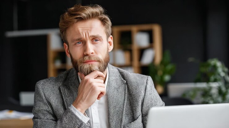 A Thoughtful Professional Engaged in Deep Reflection: A Snapshot Journey from Contemplation to Insight in a Modern Workspace Environment