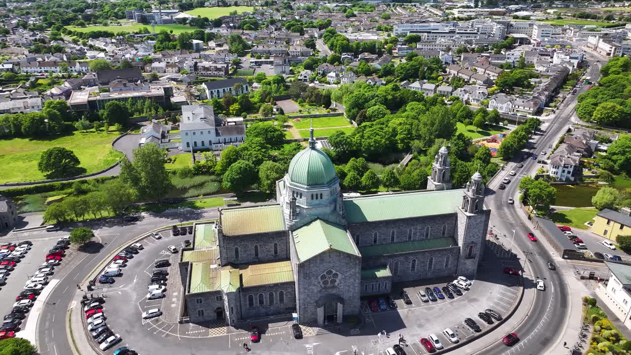 Galway Cathedral aerial dynamic spin to church. Sunny day on West Coast, Ireland.