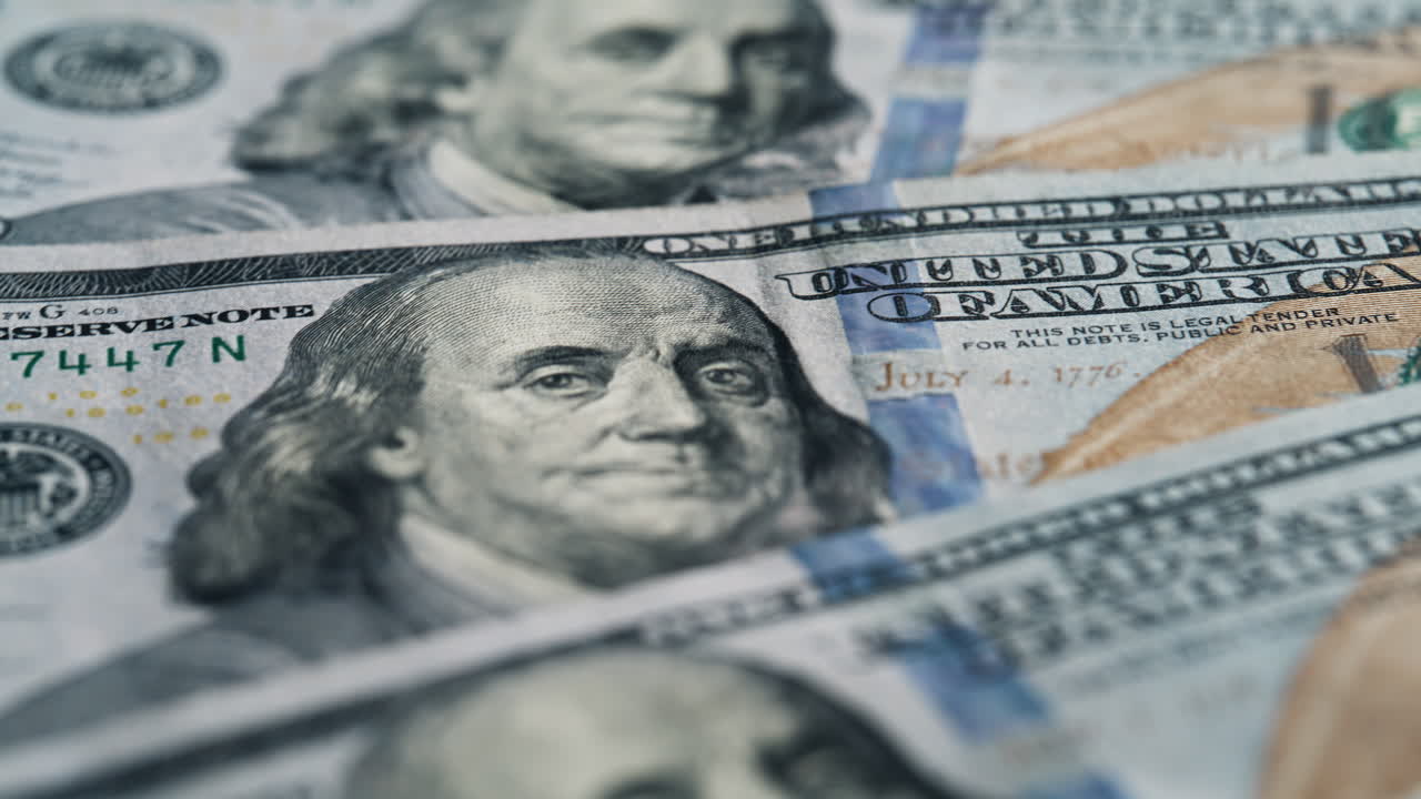 Closeup cash money background. Many 100 dollar bills. US national paper currency