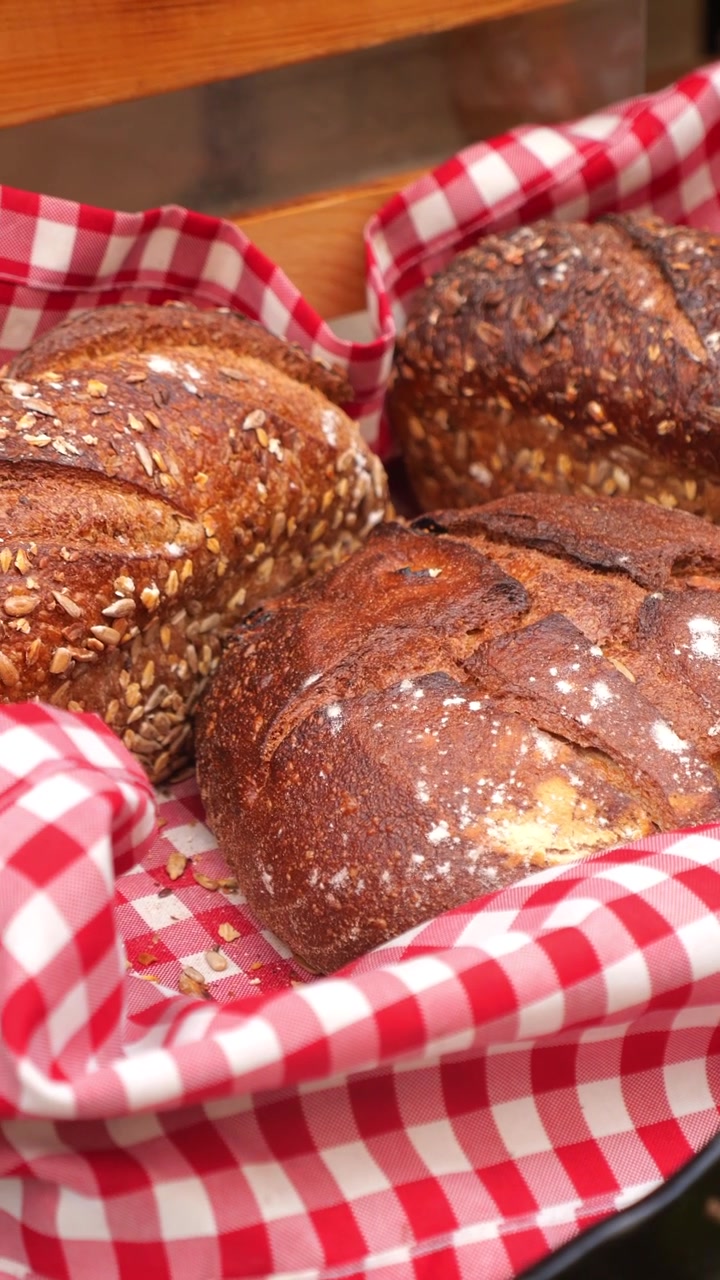 Freshly Baked Artisan Bread Loaves in a Rustic Basket
