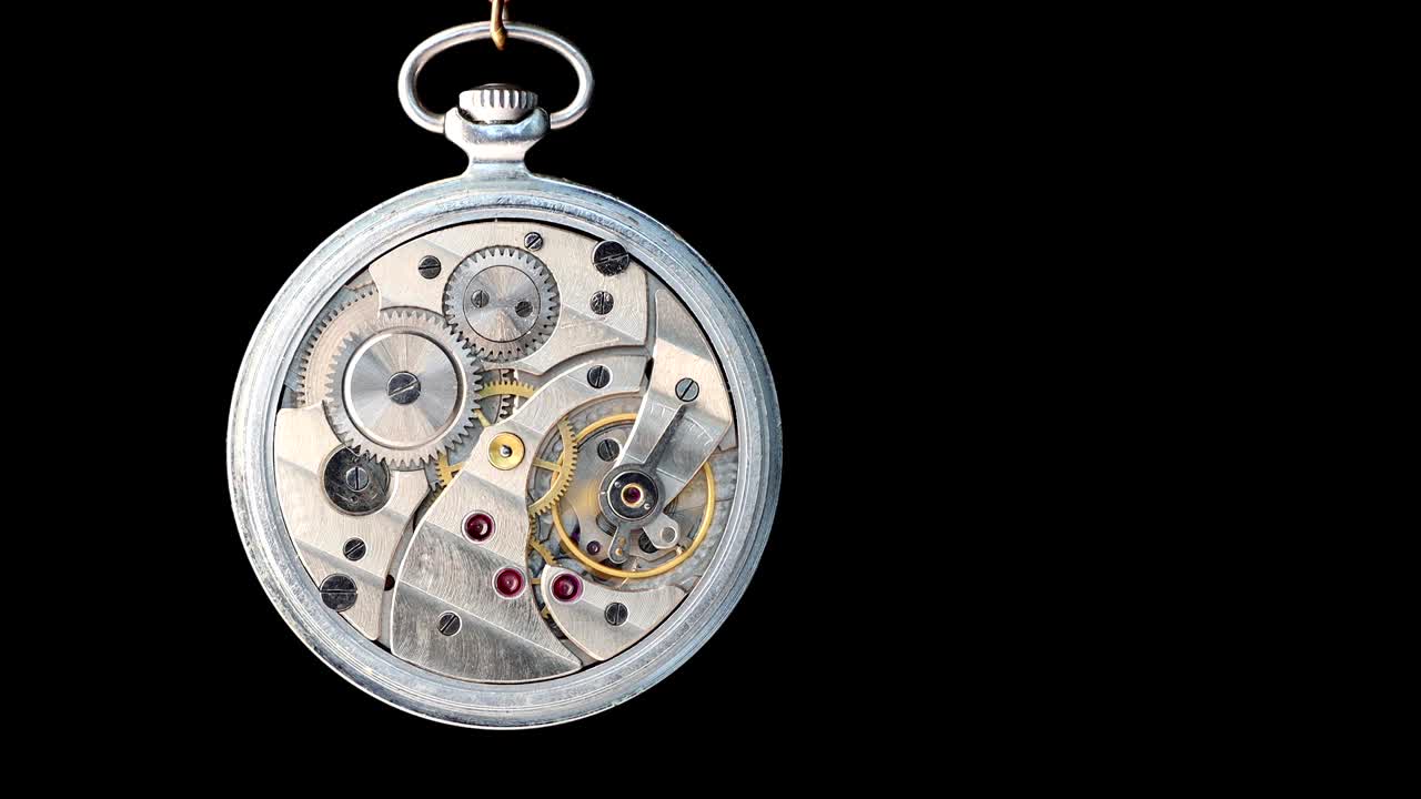 Old mechanic pocket watch open for repair. Isolated on black.