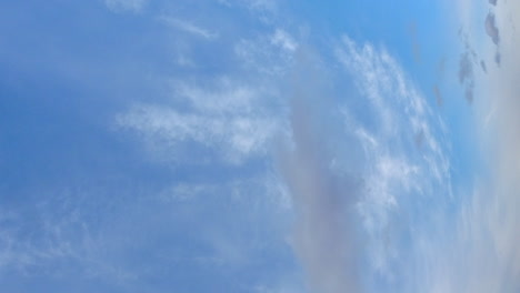 Vertical-format:-Cumulus-and-cirrus-clouds-time-lapse-on-blue-sky-day