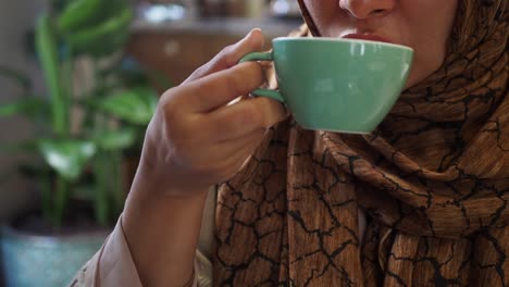 woman drinking coffee in a cafe