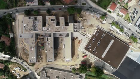 new building construction. construction workers in the roof