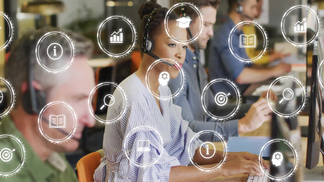 Animation of business icons over diverse business people in office