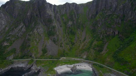 Aerial-backwards-shot-of-a-scenic-sandy-double-beach-in-Norway