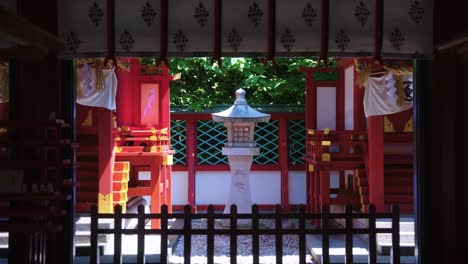stone lantern and temple at hei shrine, tokyo japan