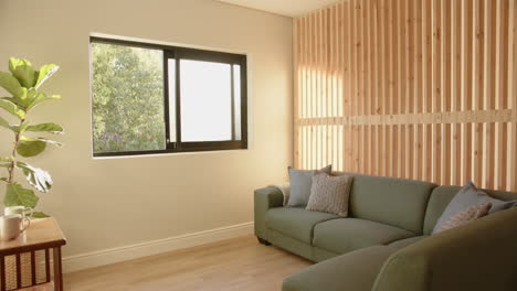 sunlit living room with green sofa and wooden wall, creating cozy atmosphere, copy space
