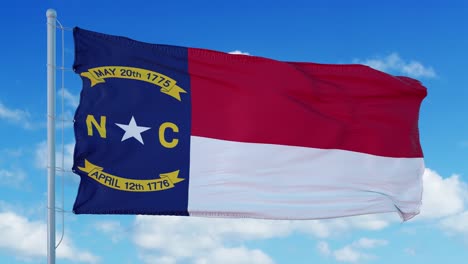 north carolina flag on a flagpole waving in the wind, blue sky background. 4k